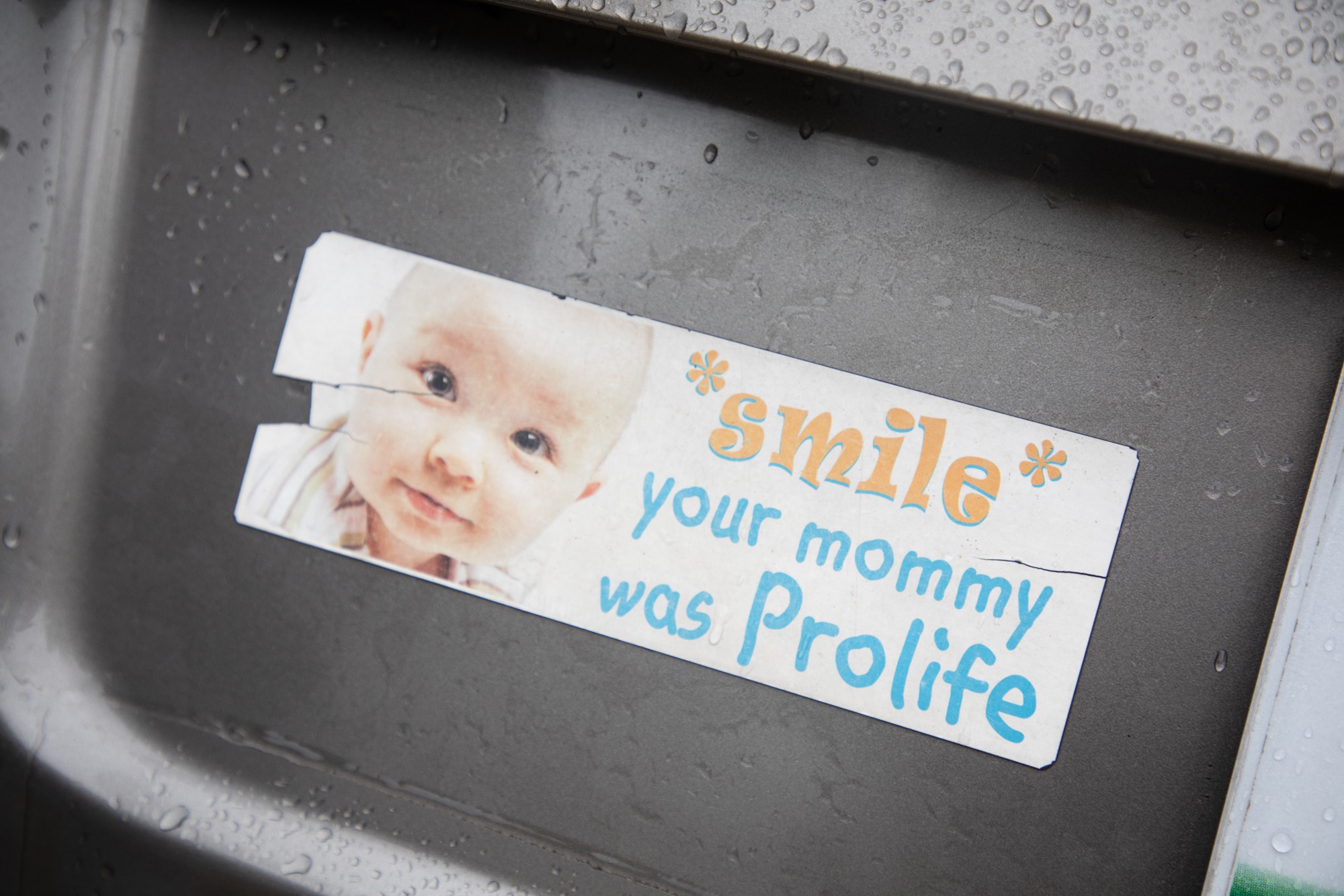 A bumper sticker on a pro-life supporter's car reads: Smile, your mommy was prolife. 